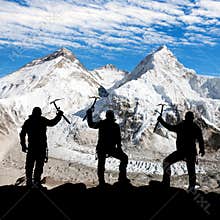 Silhouette of men with ice axe in hand, Mount Everest