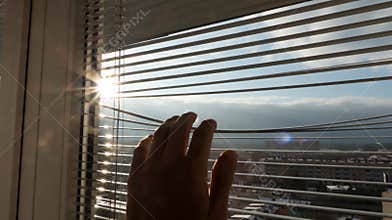 Man looking at sunrise and black clouds - new day new hope concept