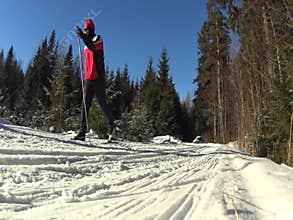 Cross country skiing man passing by