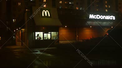 People in the car in line at McDonald's