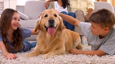 Happy family smiling with their dog