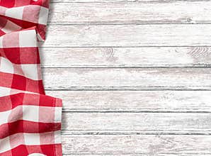 Kitchen table background with red picnic cloth