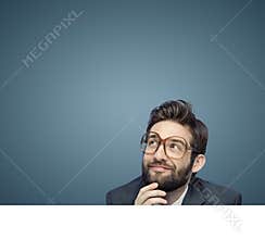 Portrait of a young employee consider his own business