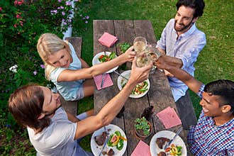 Friends toasting outdoors