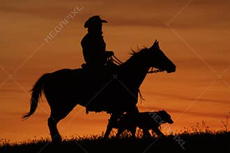 Cowboy and Dog Silhouette