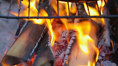 Preparing charcoal from wood.