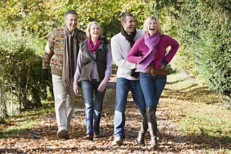 Family group walking through woods
