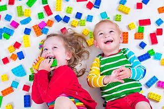 Kids playing with colorful blocks