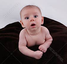Cute Curious baby learning to crawl