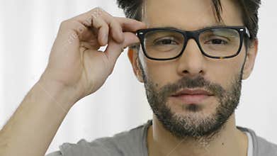 Laughing man wearing specs