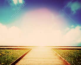 Wooden path leading to crossroads. Direction, way to choose