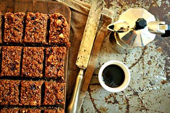 Italian breakfast with chocolate cake and coffee on a vintage board