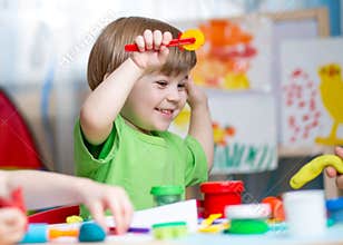 Kids with play clay at home