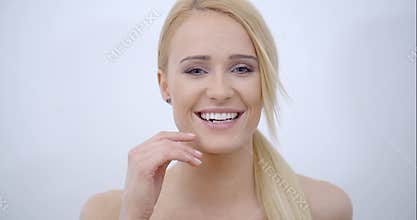 Smiling Bare Woman Touching her Face