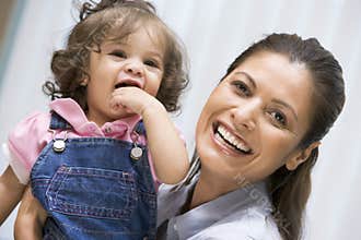 Mother holding young girl