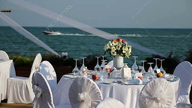 Outdoor Table Setting at Wedding Reception by the Sea