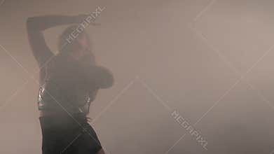 Mysterious girl with long hair dancing in the body