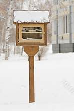 A small library with free books on the street in the form of house