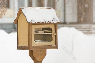 Small booth with free books on the street