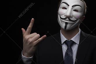 Anonymous activist hacker with mask studio shot