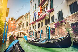 Gondolas on canal in Venice, Italy with retro vintage Instagram