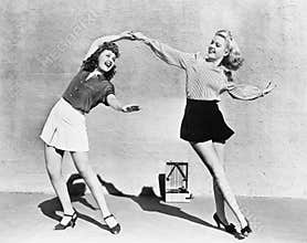 Two women dancing outside