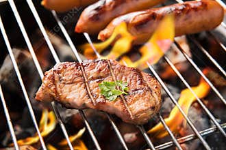 BBQ sausages and meat on the grill.