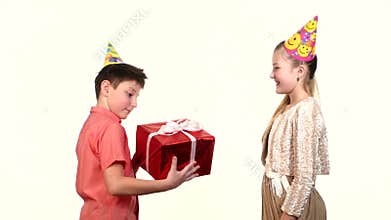 Girl gives a boy gift red. The guys kiss each