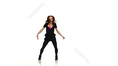 Attractive, sexy, red girl in dark clothes dancing