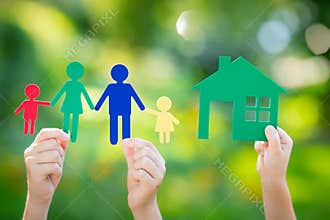 Paper house and family in hand