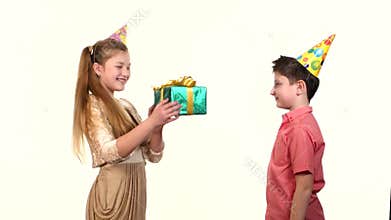 Little boy gives a girl box with gift green