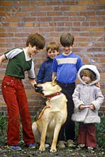 Children posing with dog, Harrison, ID