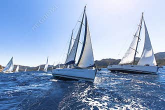Sailing in the wind through the waves at the Aegean Sea in Greece.