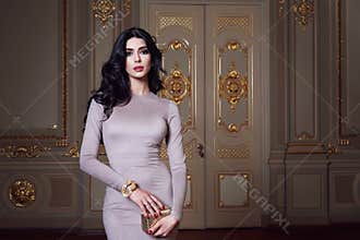 Beautiful woman in elegant dress fashionable autumn Collection of spring long brunette hair makeup tanned slim body figure ac