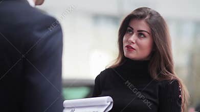 Beautiful girl talking to a sales manager