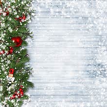 Christmas border with holly and nutcracker on vintage wood.