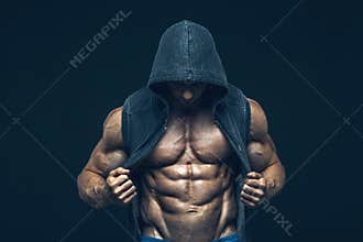 Man with muscular torso. Strong Athletic Men