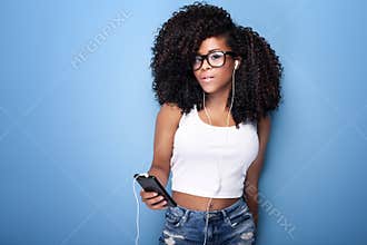 Young girl listening to music.