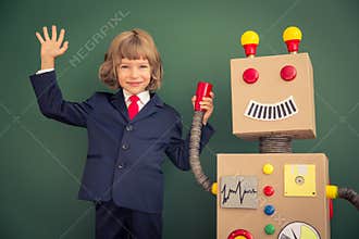 Kid with toy robot in school