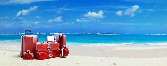 Red Luggage at the beach