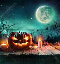 Halloween Pumpkin In A Spooky Forest At Night