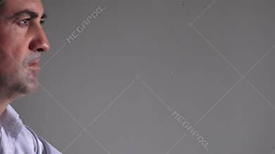 Man in his forties (40s) sitting at a table upset