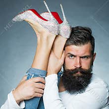 Man holding legs of woman