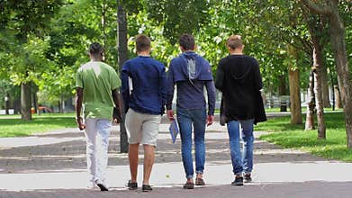 College of students walking together on campus