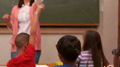 Smiling teacher choosing a pupil