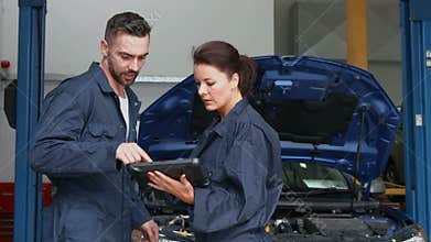 Mechanics overhauling an engine