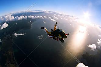 Portrait of two skydivers in action