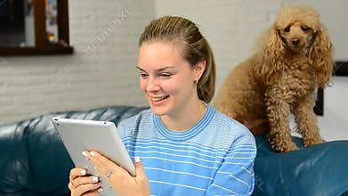 Happy attractive young woman having a video chat