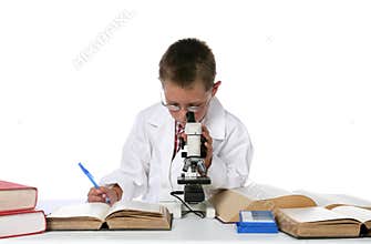 Young boy looking through microscope