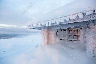 Frozen house in Finland behind arctic circle